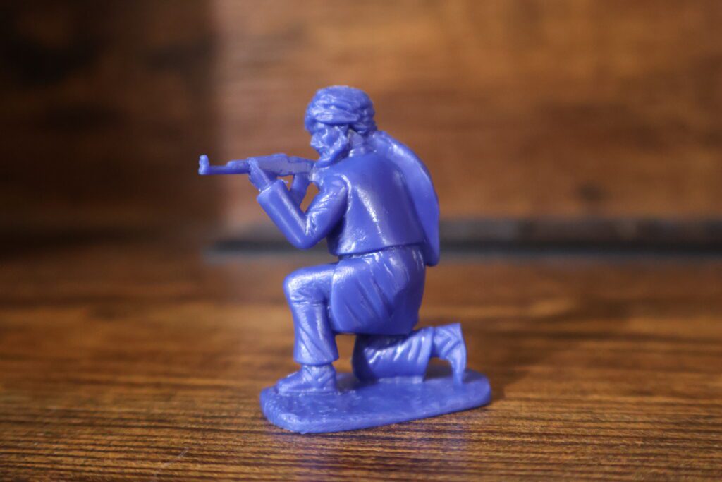 crouching blue army men